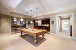 This stunning property boasts a luxurious game room, perfect for entertaining guests.