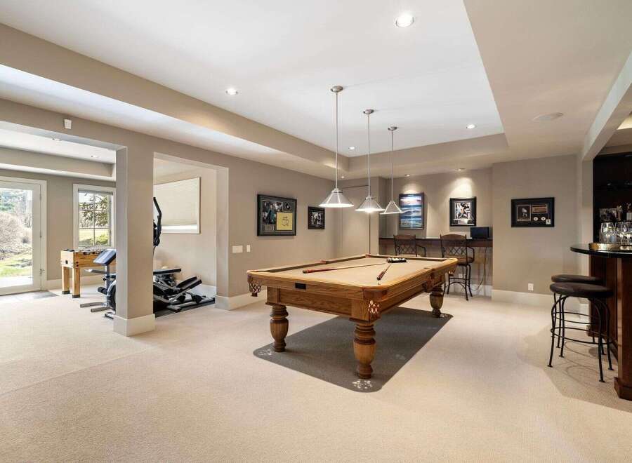 This stunning property boasts a luxurious game room, perfect for entertaining and relaxation.