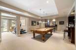 This stunning property boasts a luxurious game room, perfect for entertaining and relaxation.
