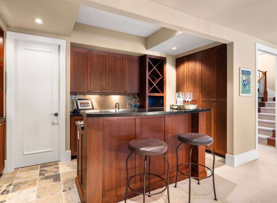 This stunning property boasts a beautifully designed bar area, perfect for entertaining guests.