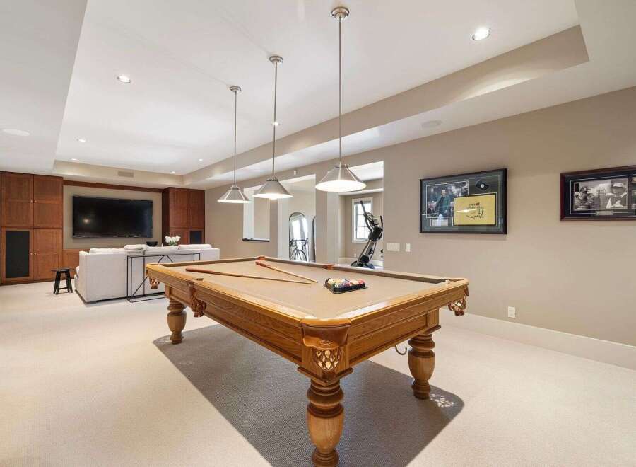 This stunning property boasts a luxurious game room, perfect for entertaining.