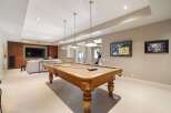 This stunning property boasts a luxurious game room, perfect for entertaining.