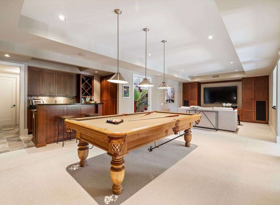 This stunning property boasts a luxurious game room, perfect for entertaining.