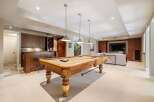 This stunning property boasts a luxurious game room, perfect for entertaining.