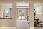 Step into a world of possibilities with this stunning property, featuring a versatile space perfect for a home gym or recreational area.