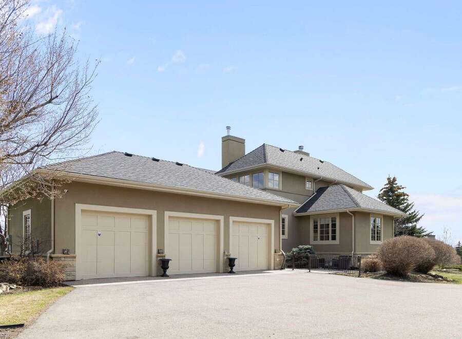 This stunning property boasts a spacious three-car garage, perfect for car enthusiasts or extra storage.