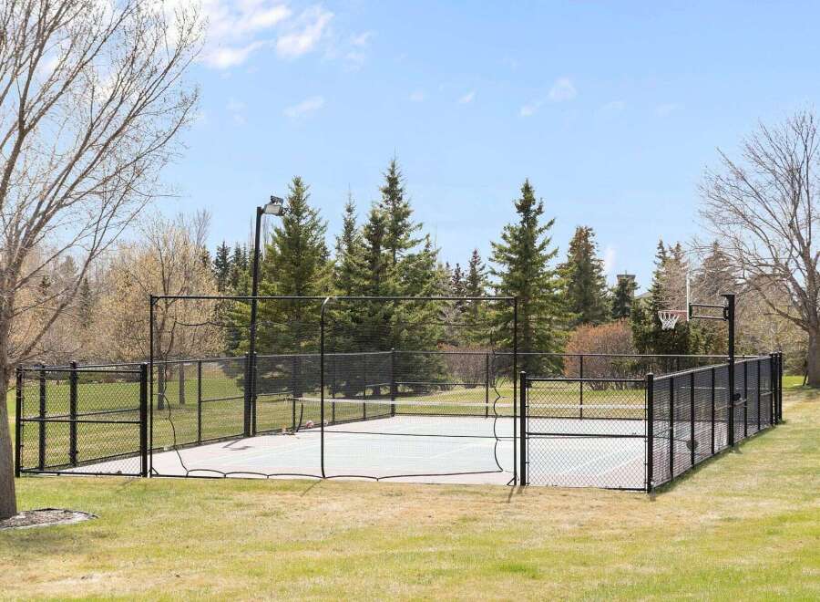 Enjoy outdoor recreation at its finest with this property's private basketball court.