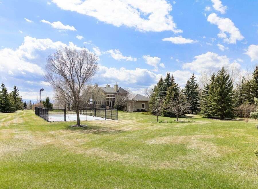 Discover luxury living in this stunning property featuring a private basketball court, perfect for sports enthusiasts.