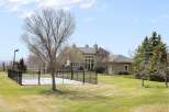 This stunning property boasts a luxurious outdoor basketball court, perfect for sports enthusiasts.