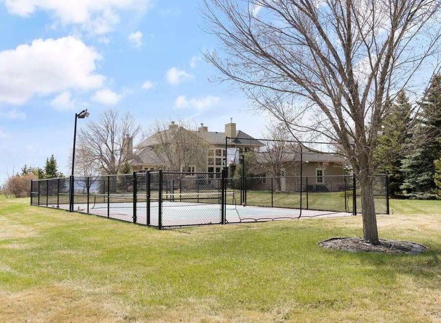 Enjoy luxury living with this stunning property featuring a private basketball court, perfect for sports enthusiasts.