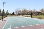 Enjoy luxury living with this stunning property featuring a private tennis court and basketball hoop.
