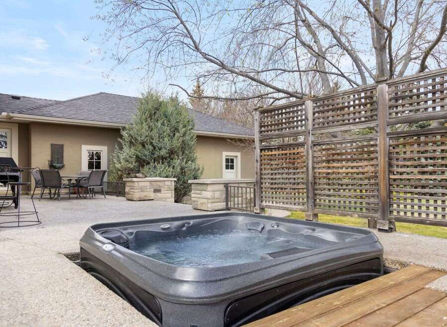 Relax and unwind in your own private oasis! This stunning property features a luxurious hot tub, perfect for enjoying the outdoors.
