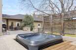 Relax and unwind in your own private oasis! This stunning property features a luxurious hot tub, perfect for enjoying the outdoors.