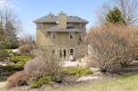 This stunning property boasts a beautiful exterior with a combination of stone and stucco.