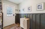 Step into this inviting entryway, showcasing a stylish blend of modern and rustic design.