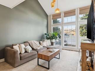 Step into luxury with this stunning living room! Featuring a cozy sectional sofa, a stylish coffee table, and a beautiful rug, this space is perfect for relaxation and entertaining.