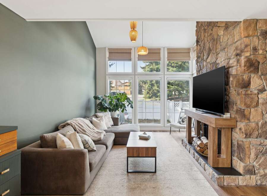 This stunning living room boasts a cozy atmosphere with a modern touch.
