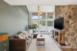 This stunning living room boasts a cozy atmosphere with a modern touch.