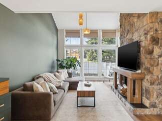 This stunning living room boasts a cozy atmosphere with a modern touch.