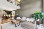 Step into luxury with this stunning property, featuring a spacious living area perfect for entertaining.