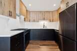 This stunning kitchen boasts a modern design with a touch of rustic charm.