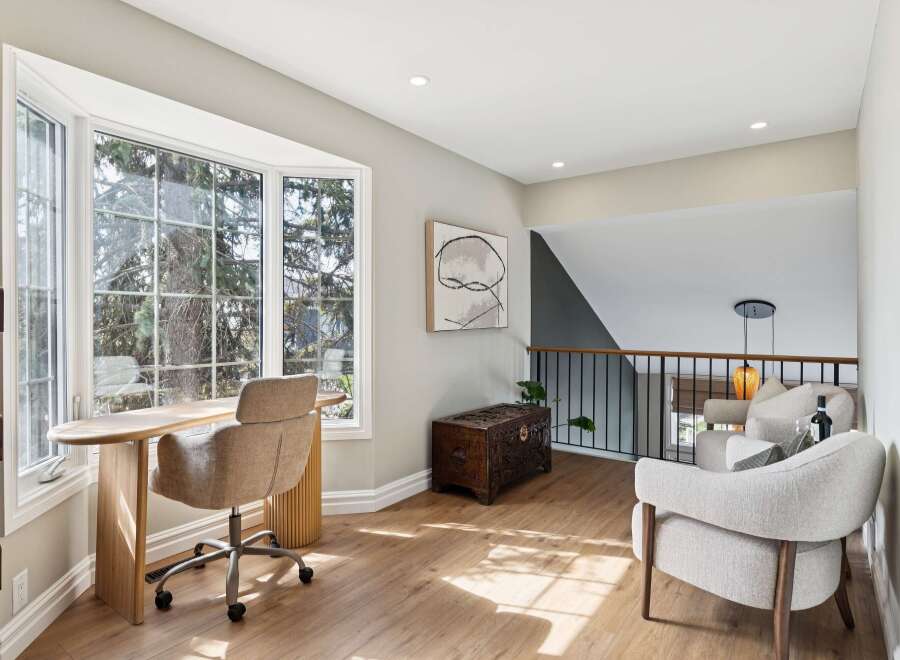 This stunning property boasts a bright and airy home office with a large bay window, perfect for enjoying natural light and scenic views.