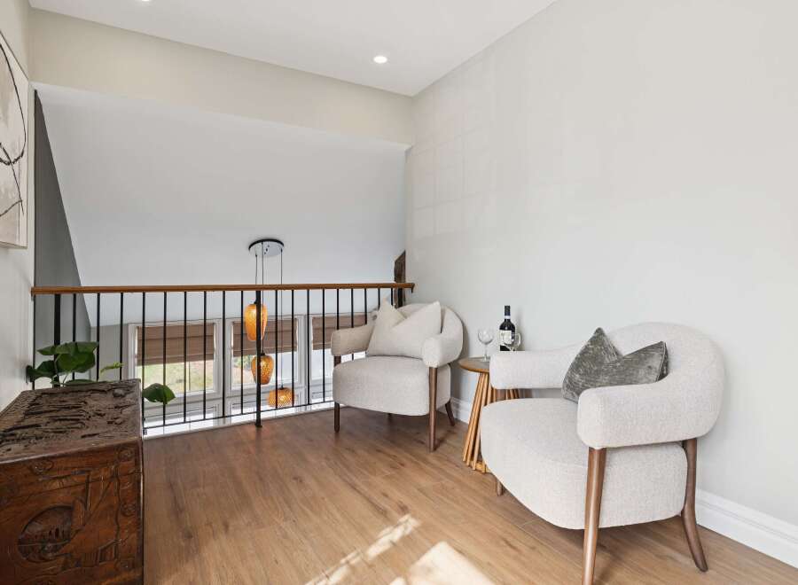 This stunning property features a cozy seating area, perfect for relaxation.