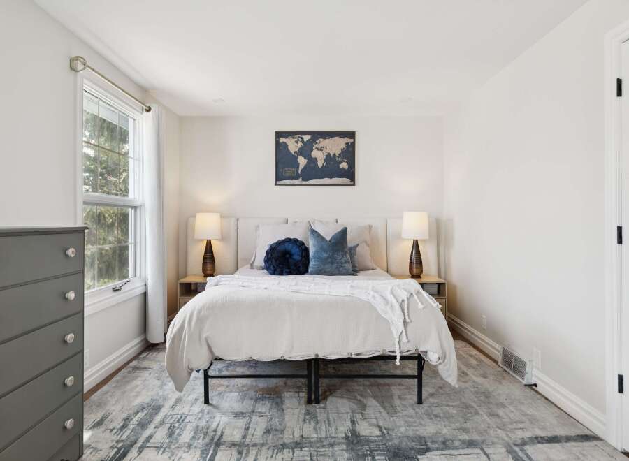 This inviting bedroom boasts a serene atmosphere, perfect for relaxation.