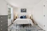 This inviting bedroom boasts a serene atmosphere, perfect for relaxation.