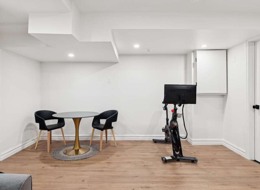 This modern space offers a versatile area for both relaxation and fitness.