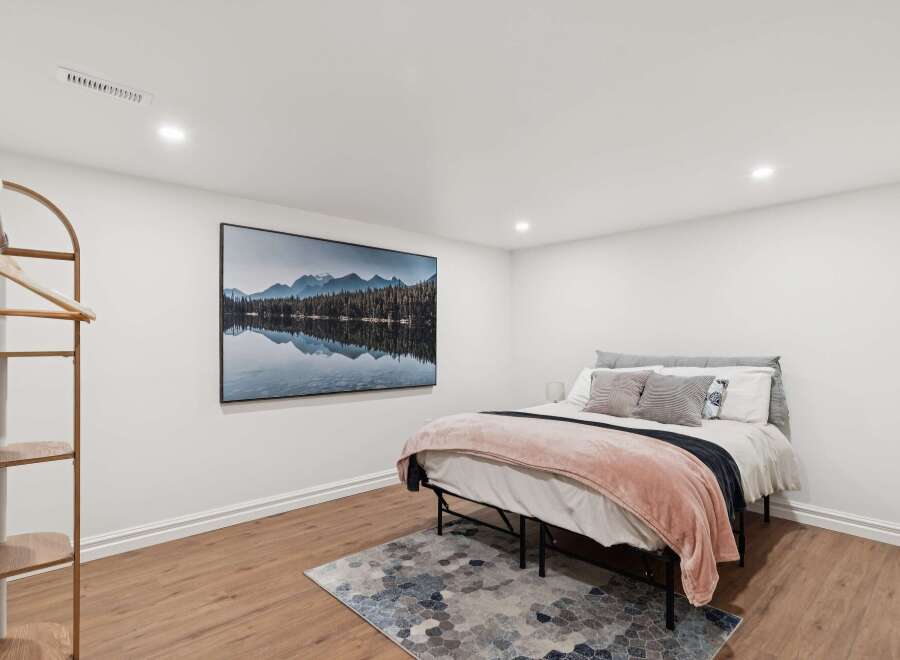 This inviting bedroom boasts a serene ambiance, perfect for relaxation.