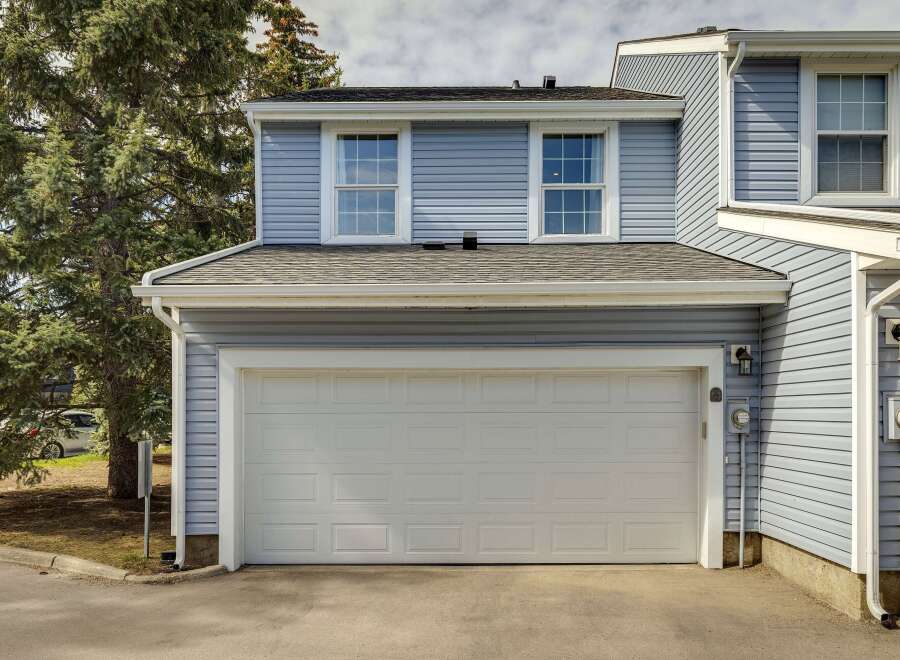 This charming townhome features a spacious two-car garage, perfect for parking and storage.