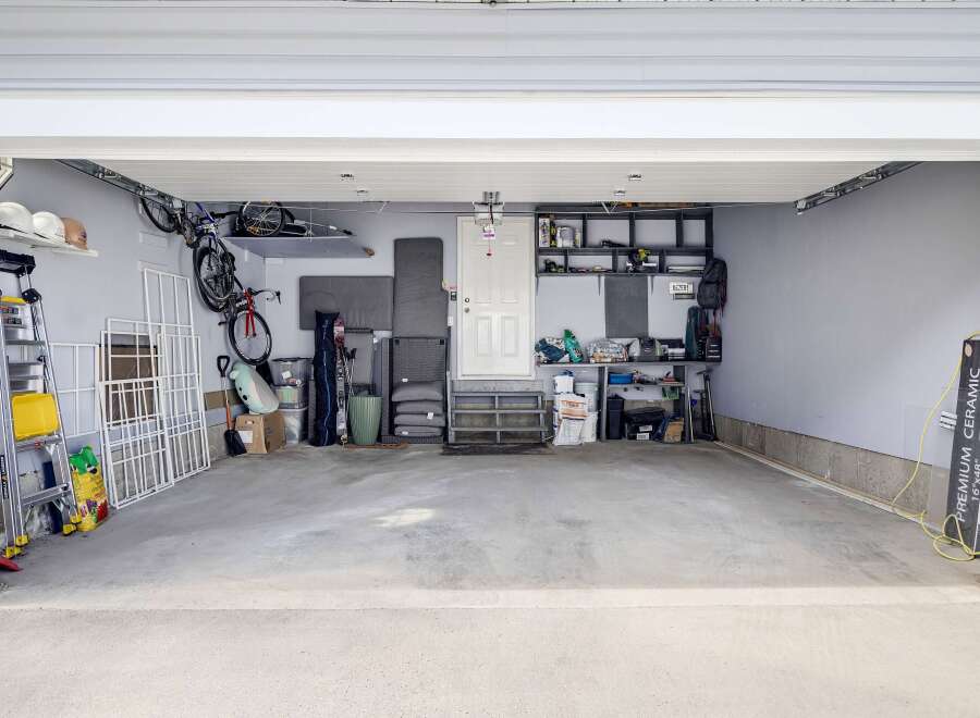 This spacious garage offers ample storage and organization solutions.