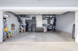 This spacious garage offers ample storage and organization solutions.