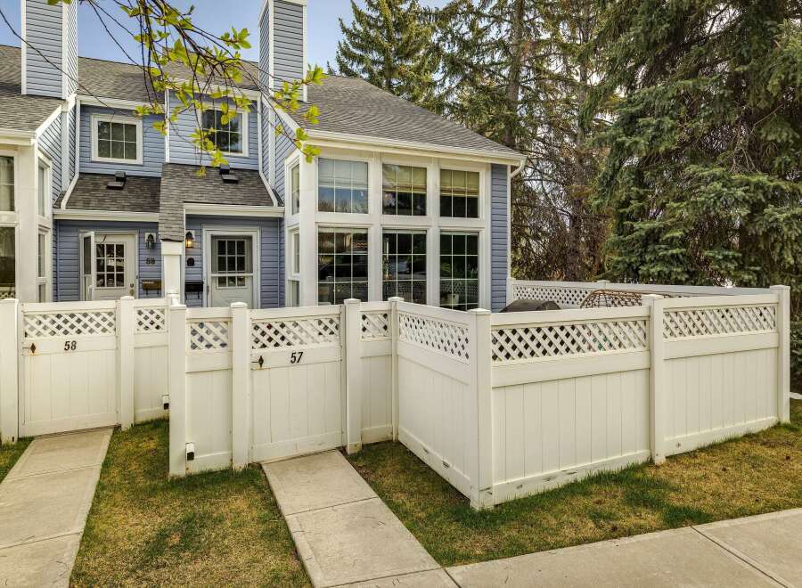 Discover this charming townhome with a welcoming facade and a private, fenced-in yard.