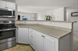 This stunning kitchen boasts modern appliances and ample counter space, perfect for culinary enthusiasts.