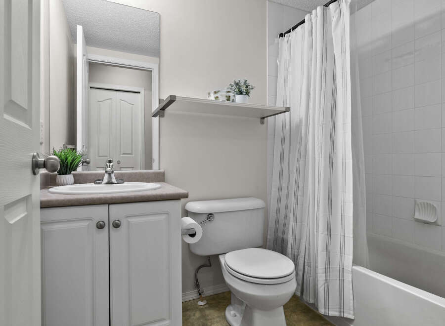 This charming bathroom features a clean and bright aesthetic, perfect for a relaxing start to your day.