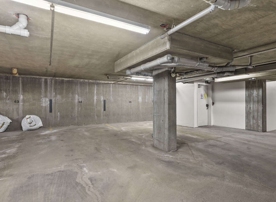 Explore the potential of this spacious parking garage, perfect for secure vehicle storage or additional property value.