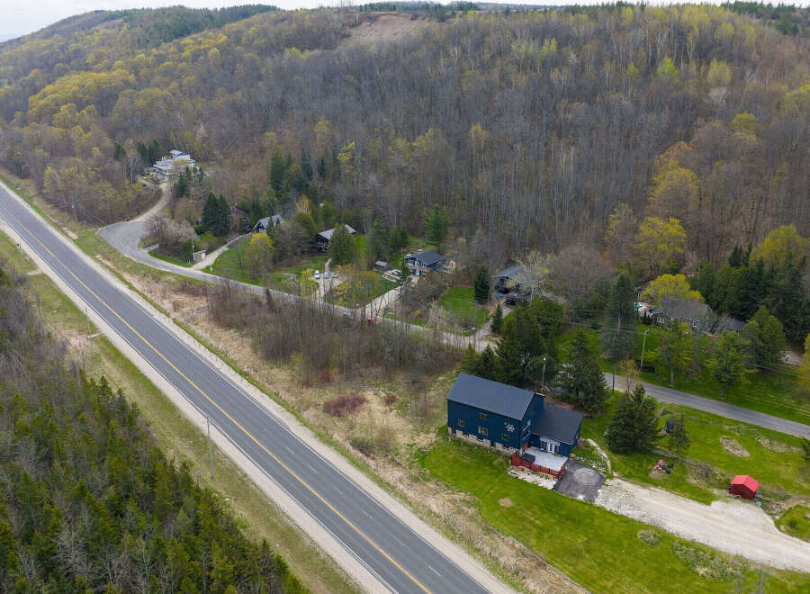 Discover a stunning property nestled in a serene, wooded landscape.