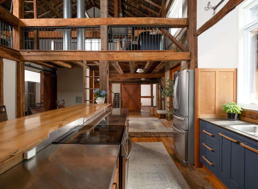 Step into rustic elegance with this stunning property, showcasing a beautifully designed kitchen with a modern touch.