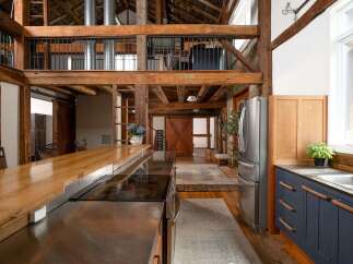 Step into rustic elegance with this stunning property, showcasing a beautifully designed kitchen with a modern touch.
