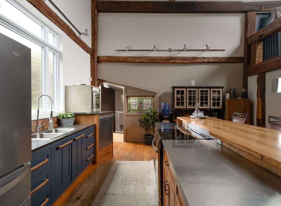 This stunning kitchen boasts a unique blend of rustic charm and modern design.
