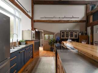 This stunning kitchen boasts a unique blend of rustic charm and modern design.