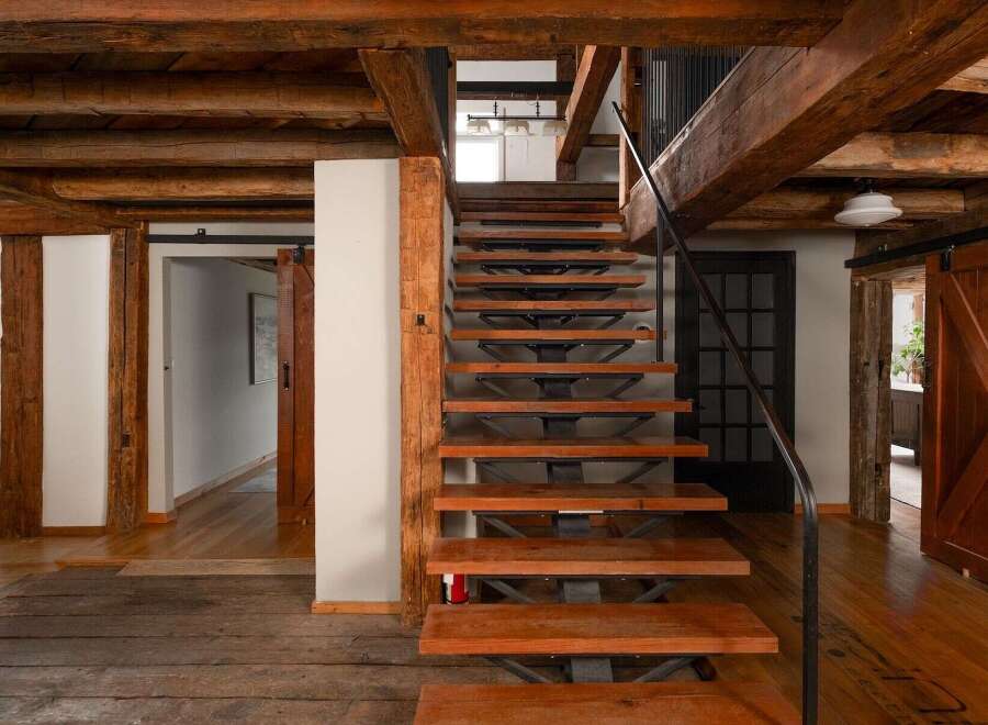 This stunning property showcases a blend of rustic charm and modern design.