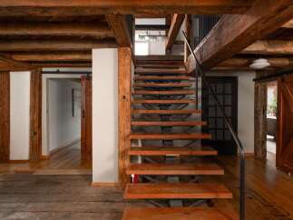This stunning property showcases a blend of rustic charm and modern design.