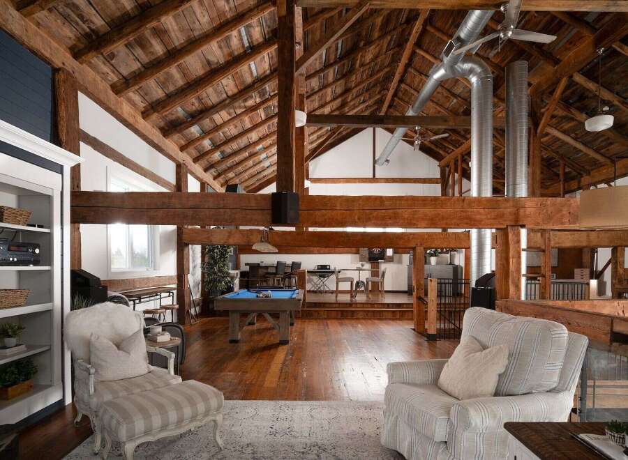 Experience luxury living in this stunning property featuring a unique barn-style design.