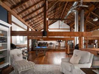 Experience luxury living in this stunning property featuring a unique barn-style design.