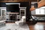 This stunning living room boasts a cozy fireplace, perfect for those chilly evenings.