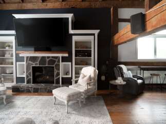 This stunning living room boasts a cozy fireplace, perfect for those chilly evenings.