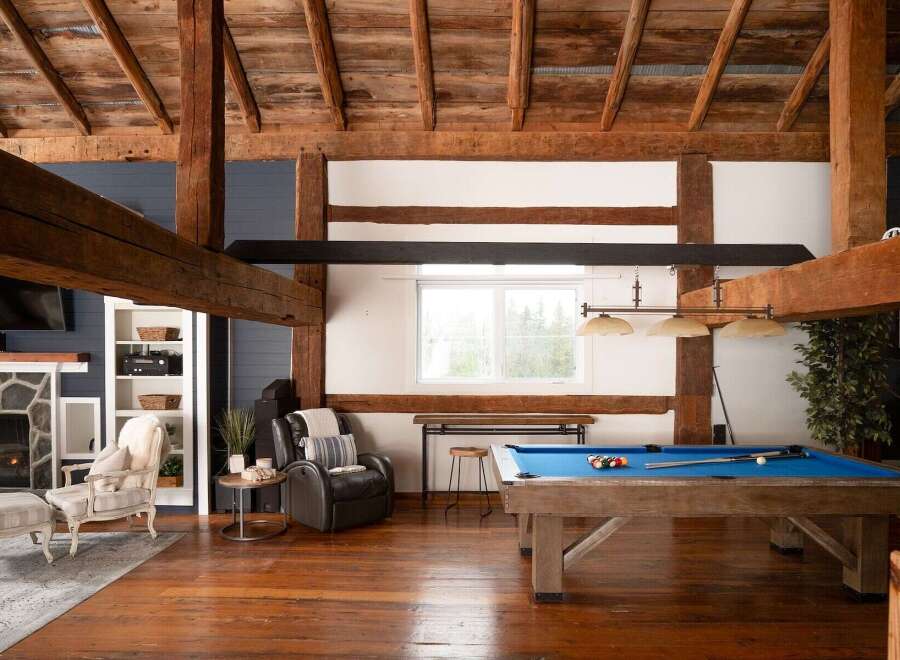This stunning property boasts a rustic charm with exposed wooden beams and a spacious layout.
